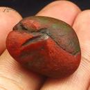 来自于云南保山的38.9CT柿子红南红YNH63，尺寸：23*18*13mm。
