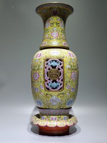 清乾隆款，珐琅彩黄地西番莲四面镂空福寿连连转心瓶