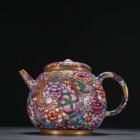 清康熙 紫砂珐琅彩凤纹茶壶。