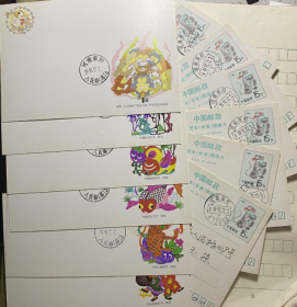 1992年猴年有奖生肖邮资明信片全套12枚，实寄封微黄或黄斑，介意慎拍，邮政用品封片，邮政编码日戳