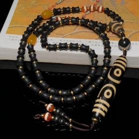 藏区回流老料高油包浆亚黄七眼天珠搭配一线天珠、两眼天珠三通、沉香编制项链
尺寸：七眼78*15毫米 沉香10*8毫米