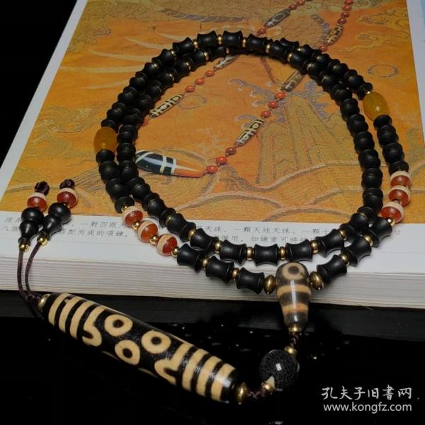 藏区回流老料高油包浆亚黄七眼天珠搭配一线天珠、两眼天珠三通、沉香编制项链
尺寸：七眼78*15毫米 沉香10*8毫米