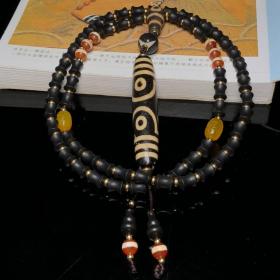 藏区回流老料高油包浆亚黄七眼天珠搭配一线天珠、两眼天珠三通、沉香编制项链
尺寸：七眼78*15毫米 沉香10*8毫米