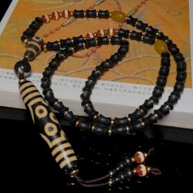藏区回流老料高油包浆亚黄七眼天珠搭配一线天珠、两眼天珠三通、沉香编制项链
尺寸：七眼78*15毫米 沉香10*8毫米