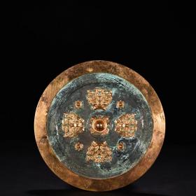 汉青铜鎏金兽面纹圆镜（透光镜）
