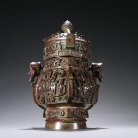 旧藏 铜饕餮龙凤纹提梁卣。