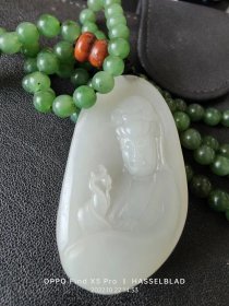 和田玉籽料观音挂件5.4/3.1/1CM。品相如图包真保平安。，