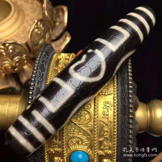 藏区回流老料高油包浆开片【连心三眼天珠】
尺寸：80*16毫米 重量34.9克