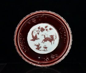 元代霁红釉雕刻麒麟凤纹盘