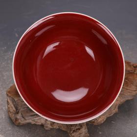 大明宣德祭红釉留白雕刻鱼澡纹瓷碗