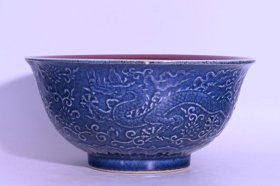 明宣德雪花兰内红釉雕刻龙纹碗，高10.8×21.6厘米