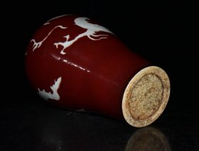 元代霁红留白雕刻龙纹梅瓶一对