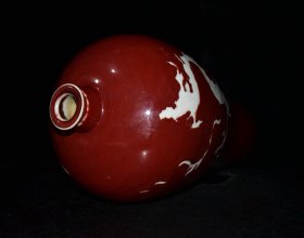 元代霁红留白雕刻龙纹梅瓶一对