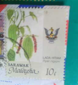 马来西亚10c老邮票一张（第二图起的马来西亚歌手庄群施图照八幅不在出售品之列）背面写上蓝筠的中文简体字 / 时年15岁