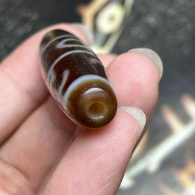 藏传天珠
 尺寸：56*13毫米风化清晰明显