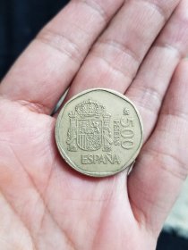 西班牙1988年500比塞塔硬币
品相如图，西班牙硬币最高面值。保真，包挂号，非假不退