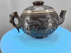 清代椰子壳雕花包银茶壶