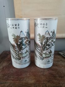 下乡刚刚收得一对江西瓷业公司款识，罗成兴作，画山水满工满彩描金口，大底多年使用平滑，带有原始老包桨帽筒一对