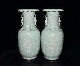清代豆青釉留白雕刻四季花卉双耳瓶一对50.3x24