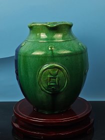 清代绿釉金钱尊瓶一个，绿釉窑变六棱瓶口，开片自然，包浆圆润醇厚，漂亮精致，保真包老！