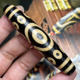 牙黄十五眼天珠尺寸：78*16毫米