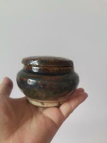 清代至民国磁州窑酱釉紫金釉围棋罐。