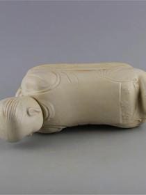 定窑白釉娃娃枕