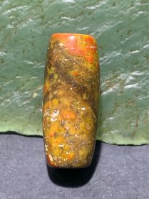 草花纹战国红玛瑙通货直桶，桶珠一颗