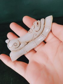 和田玉手工雕刻祝寿手把件一个，包浆均匀光滑，雕刻精细，形象逼真，品相如图