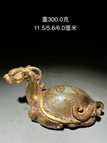 描金龙龟高古和田玉手把件一个。