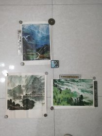 1977年美术印刷品3幅合售。①赤水春晨（中国画）38x35㎝。作者：秦剑铭。江苏人民出版社。②峡谷新颜（油画）37x26cm。作者、姚钟华。上海人民出版社。③云山新绿（中国画）37x26㎝。作者：邓耀华。上海人民出版社。