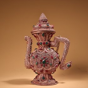 尼泊尔  西藏工艺纯手工镶嵌宝石花丝酒壶
工艺精湛  器型款式精美
重550克    高21厘米  宽14厘米