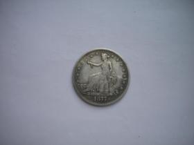 《外国钱币坐人像1877年》。直径4.5厘米，N483号，再版外国钱币
