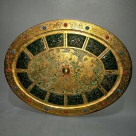 战汉时期鎏金镶翡翠镶宝石椭圆形青铜镜