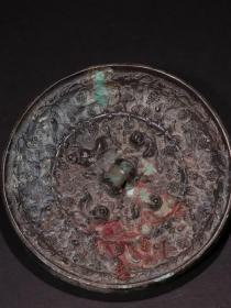 唐代 花鸟螭虎纹铜镜。